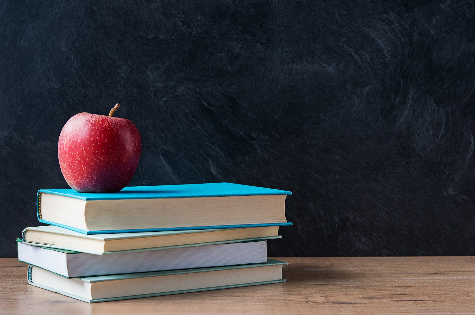 Best School Districts in Austin: books and an apple