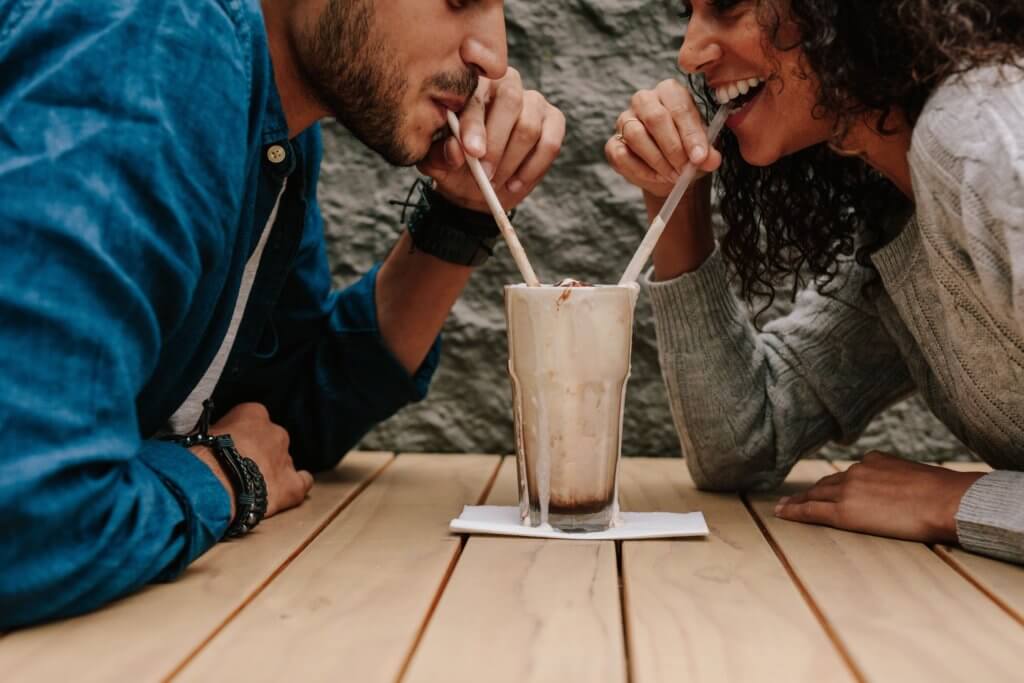 best milkshakes in Austin: couple sipping a milkshake