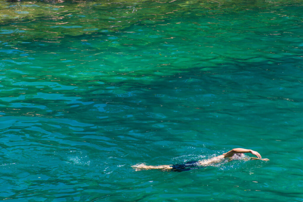 person swimming in Barton Springs