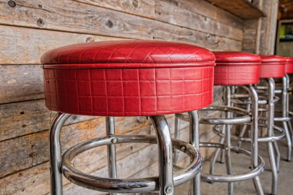 shiny red bar stools in restaurant