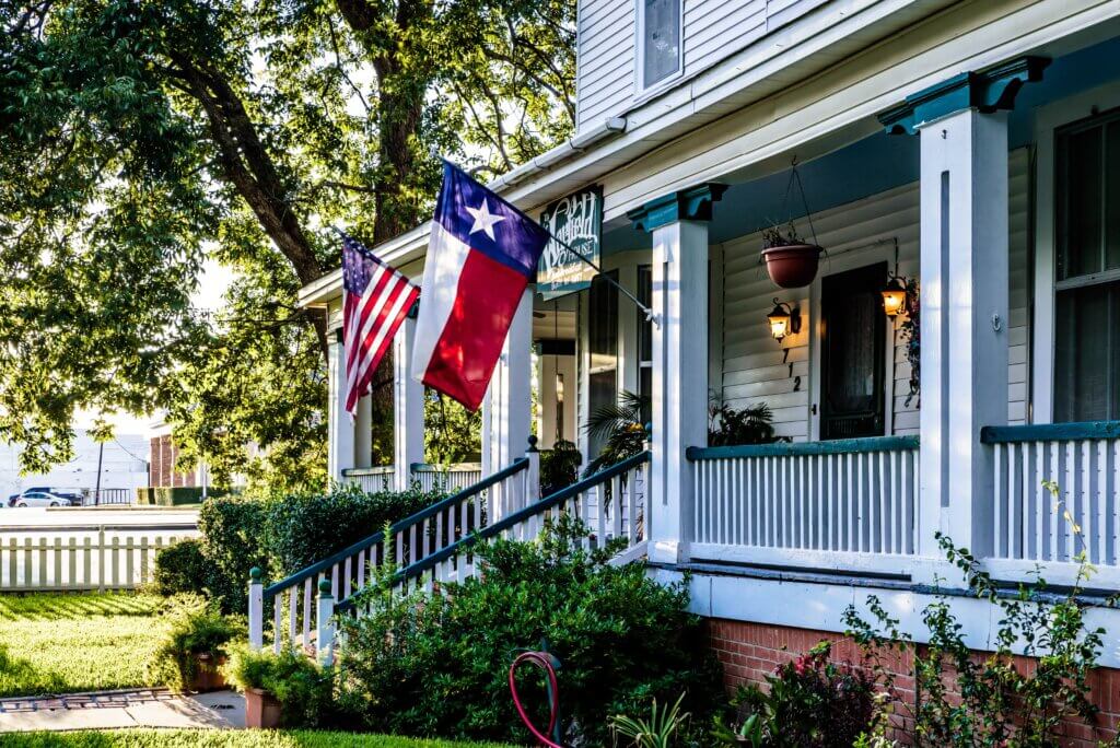 buy a house in austin: Texas home with flags