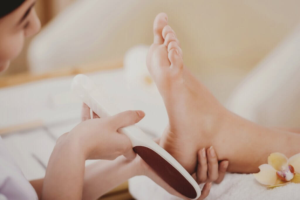 woman getting a pedicure and foot scrub 