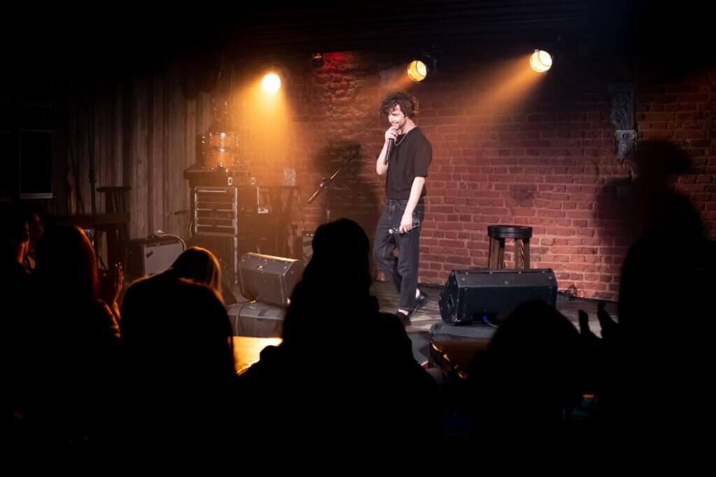 Comedian on stage at a show