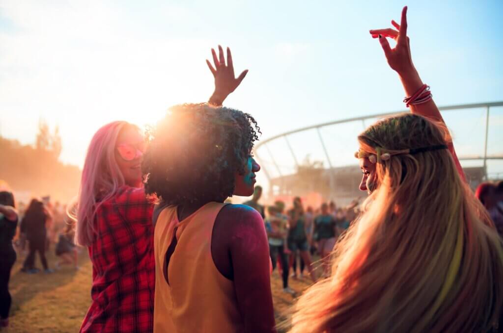 women dancing together at festival