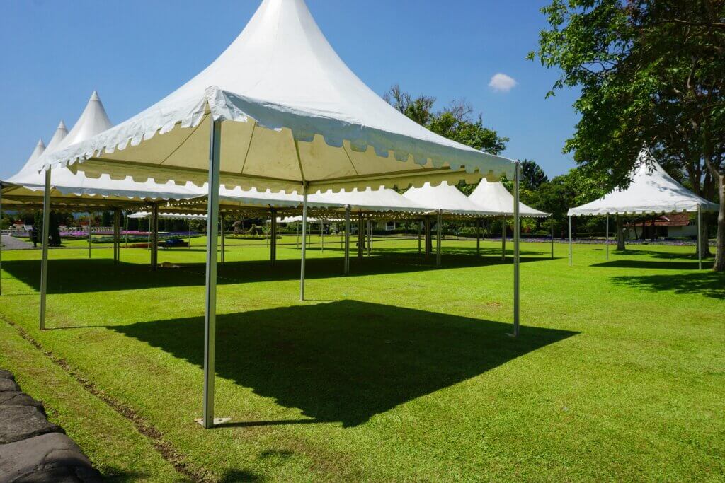 White tent on grass for an event