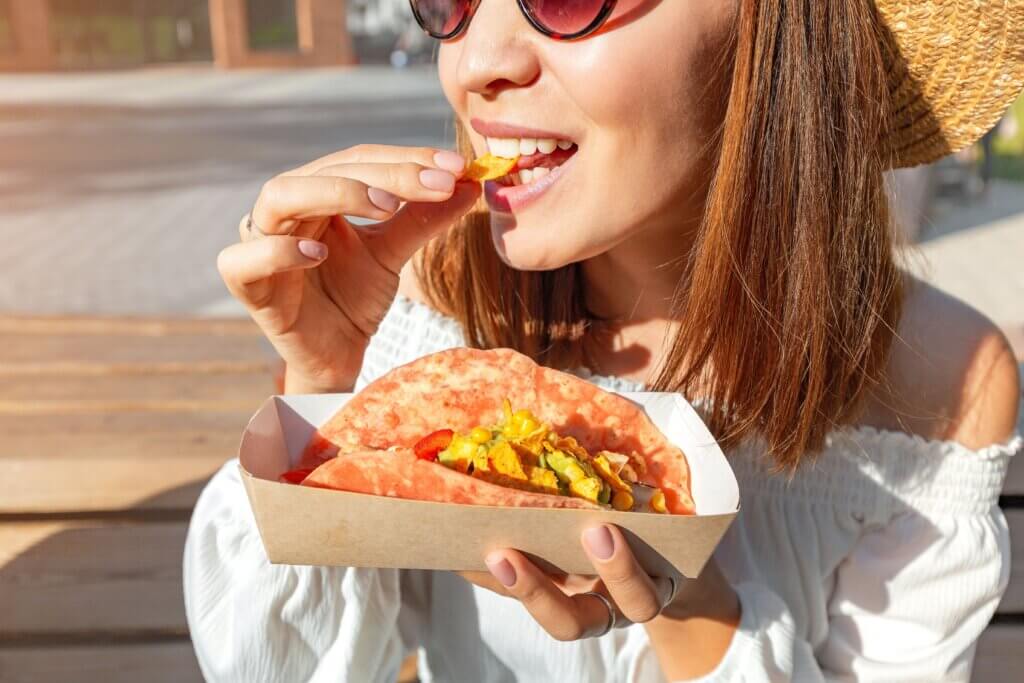 Woman eating a taco
