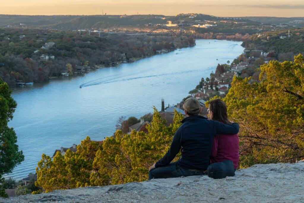 couple sitting on Mount Bonnell over Austin, Texas