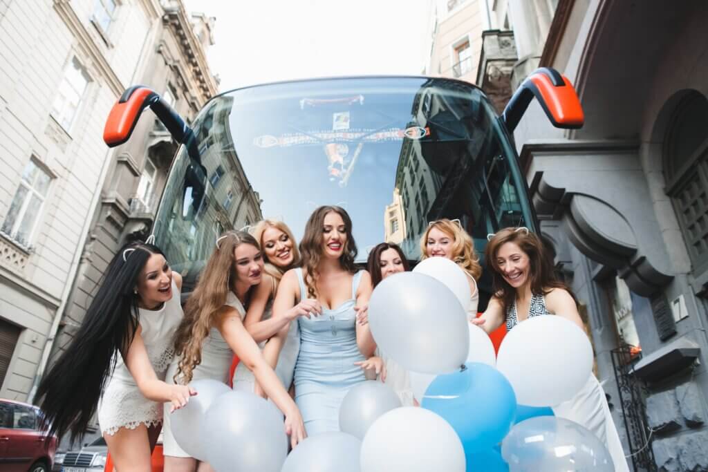 Austin bachelorette party: women in front of a tour bus